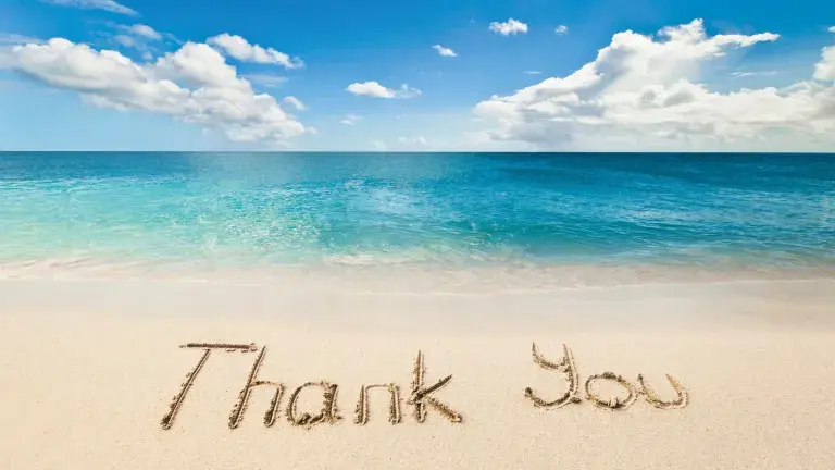 Thank You im Sand geschrieben